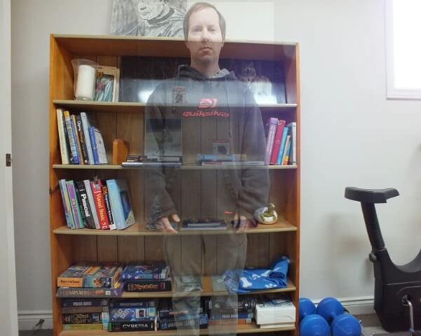 While standing in front of a bookshelf you can see through me.
